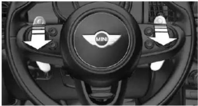 Interior view of a car dashboard with the Mini wheel and steering wheel (no visible text or symbols)