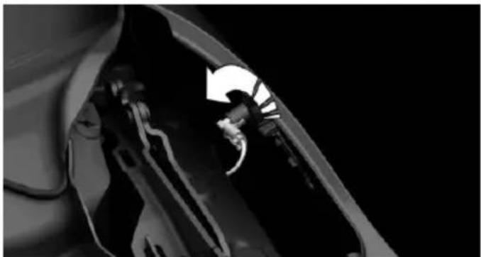 Close-up of a mechanical component with a curved arrow indicating direction (no visible text or symbols)
