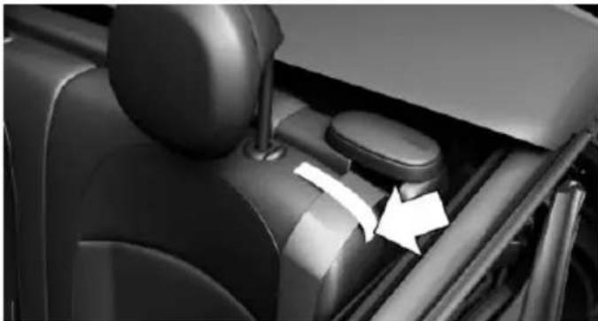 Interior view of a car showing the wheel, seat, and dashboard with directional arrows indicating movement (no text or symbols)