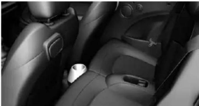 Interior view of a car showing leather seatbelt and dashboard (no visible text or symbols)