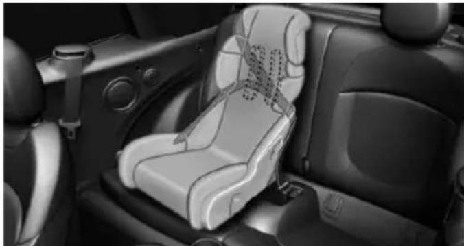 Interior view of a car showing a car seat with a logo on the seat, no visible text or symbols.
