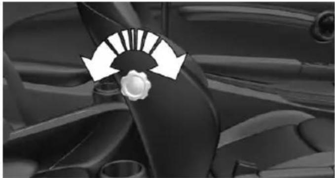 Close-up of a car dashboard with directional arrows indicating motion or wheel movement (no text or symbols)