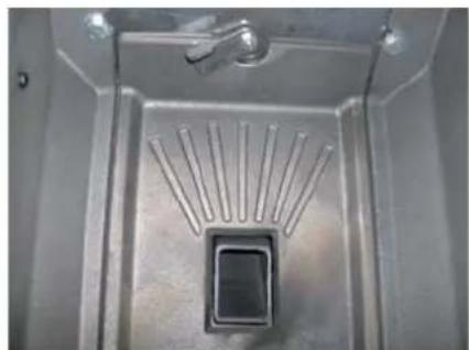 Metallic tray with a central square component and radial metal strips, no visible text or symbols