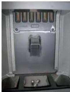 Interior view of a stainless steel appliance with water level control panel and sink (no visible text or symbols)