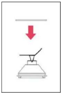 Diagram showing a downward arrow labeled '↓' pointing to a simple diagram of a lamp or lamp with a handle.