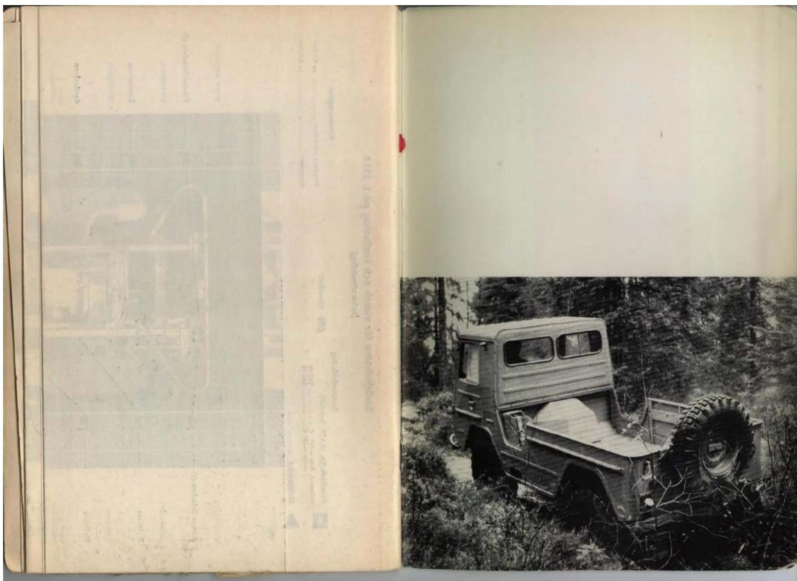 Scanned page from a vintage document showing a historical photo of a military truck parked in a forest, with Chinese text on the left margin.