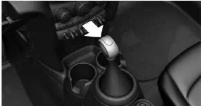 Close-up of a car gear shift lever mechanism (no text or symbols visible)
