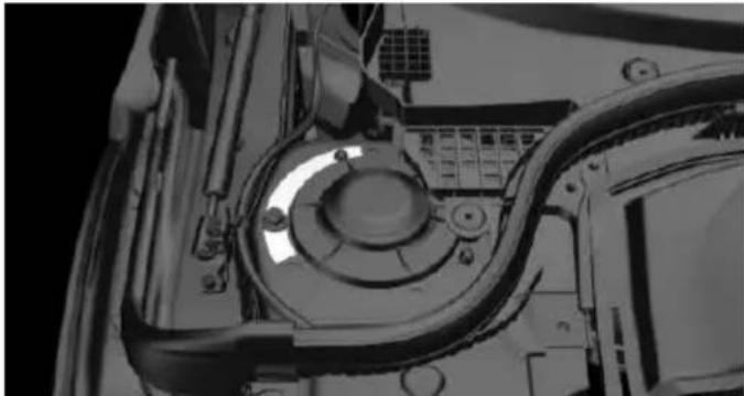 Close-up of a mechanical component with visible wiring and a central circular dial (no text or symbols)