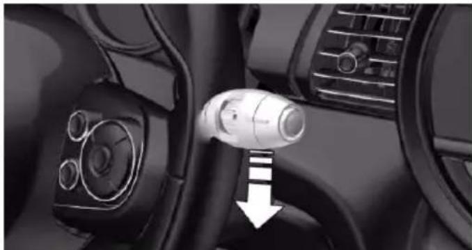 Interior view of a car dashboard and steering wheel (no visible text or symbols)