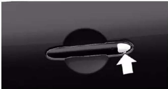 Close-up of a black curved object with a white arrow pointing to it, against a dark gradient background (no text or symbols)