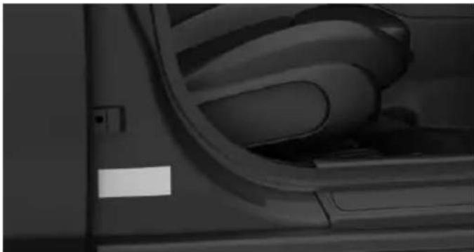 Close-up of a car interior showing the wheel and seat area (no visible text or symbols)