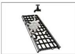 Metal grid device with a small water tap and a star-shaped object on its side (no text or symbols visible)