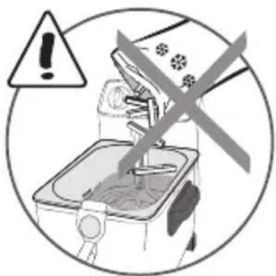 Warning symbol with exclamation mark over a kitchen appliance, indicating hazardous or hazardous use.