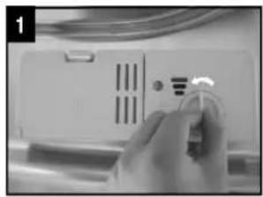 Close-up of a hand pressing a button on a white electronic device panel (no visible text or symbols)