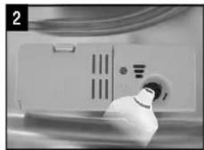 Close-up of a medical device with a metallic tool inserted, showing no visible text or symbols.