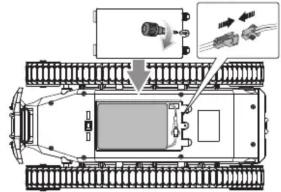 Technical diagram of a tracked vehicle with labeled components and directional arrows indicating movement or assembly.