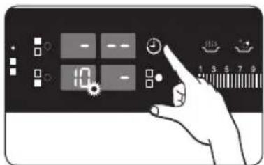 Hand interacting with a digital control panel showing status indicators and a numeric display