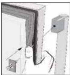 Illustration of a door with a hand holding a tool, next to a wall-mounted device (no text or symbols visible)