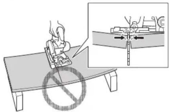 Diagram illustrating a mechanical or electrical setup with a person operating a device on a table, accompanied by an inset showing a close-up of the component being inserted.