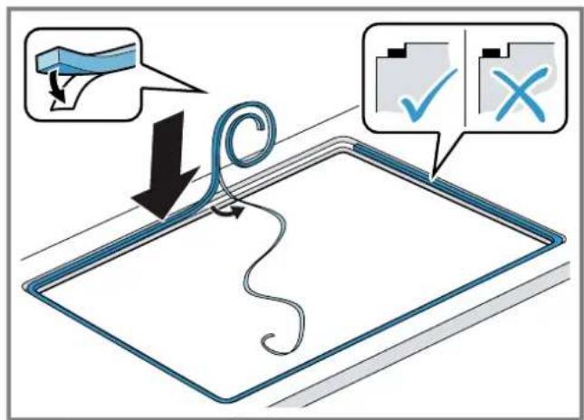 Diagram illustrating a cable being inserted into a tray, with instructional annotations and checkmarks indicating approval or rejection actions.