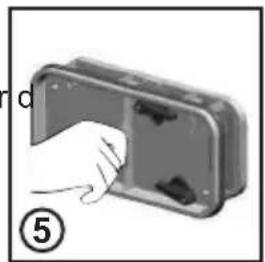 Hand inserting a component into a device housing (no text or symbols visible)