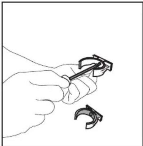 Line drawing of a hand holding a tool with a curved handle, next to a separate curved hook (no text or symbols).