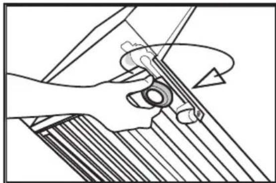 Line drawing of a hand holding a tool with a circular component, no text or symbols present.