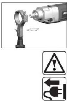 Diagram showing a drill bit being inserted into a plug, with warning symbols indicating hazard and electrical hazard.