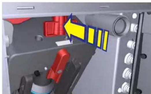 Interior view of a mechanical device showing a red and yellow component with a blue arrow pointing to a yellow section, no text or symbols visible.