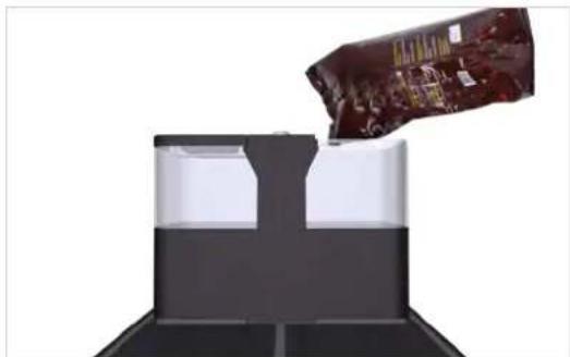 Close-up of a chocolate snack being poured into a glass container (no text or symbols visible)