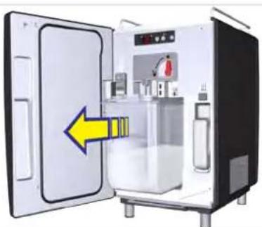 Interior view of a laboratory or chemical chamber with a yellow arrow pointing to the door (no visible text or symbols)