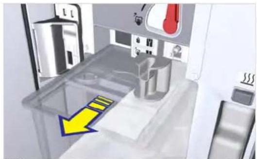 3D printer interior view showing internal components and a yellow arrow indicating a directional flow (no text or symbols)