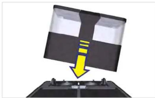 Diagram showing a device with a yellow arrow pointing downward to a black panel, mounted on a base, no text or symbols present.