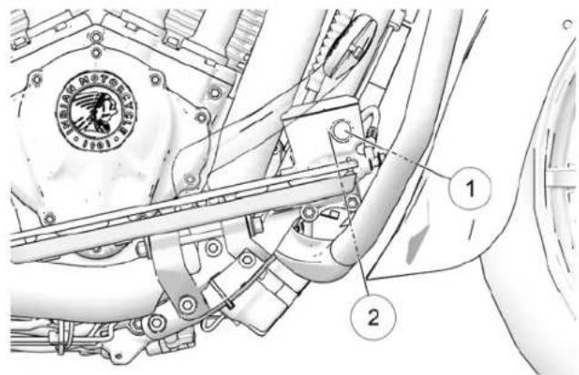 Technical diagram of a mechanical assembly with labeled parts, including a circular emblem and numbered annotations.