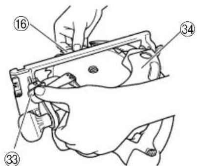 Technical diagram of a mechanical assembly with numbered parts labeled 16, 34, and 33