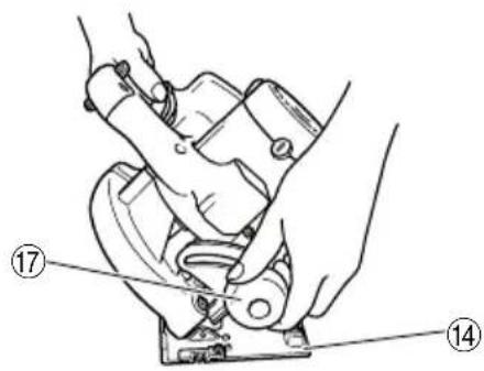 Technical diagram showing hands operating a mechanical device with numbered annotations (14 and 17)