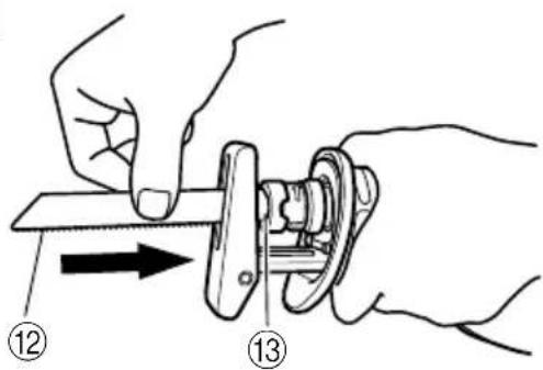 Diagram showing hands using a tool to adjust a mechanical component, labeled with parts 12 and 13.