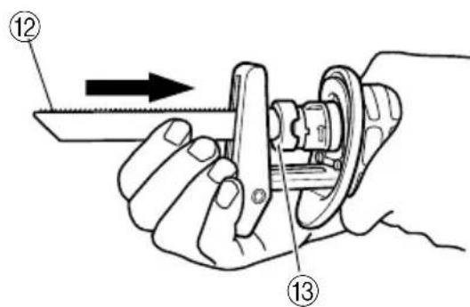 Diagram showing a hand holding a mechanical component with numbered parts and an arrow indicating direction