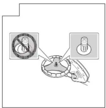 Diagram showing a mechanical component with two circular features and a pin, one marked with a crossed-out ring symbol.