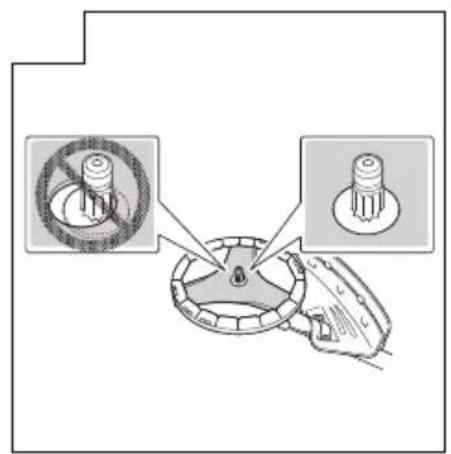 Diagram showing a mechanical component with two circular features and a magnified inset highlighting a disassembled part.