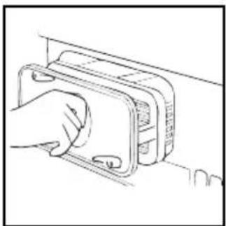 Line drawing of a hand inserting a component into a device (no text or symbols)