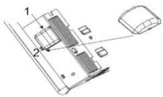 Technical diagram of a device with labeled components, showing parts 1 and 2 connected to a housing or enclosure.