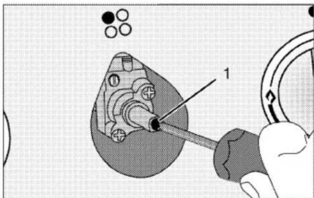 Technical diagram showing a mechanical assembly with labeled component '1' and a tool interacting with a ring.