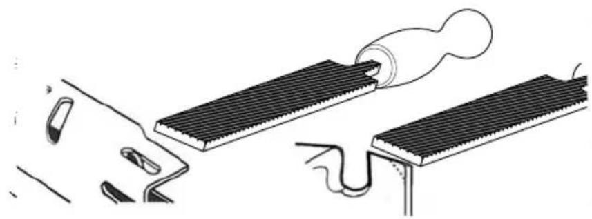 Diagram showing a tool interacting with two rectangular electronic components, one emitting a cable (no text or symbols present)