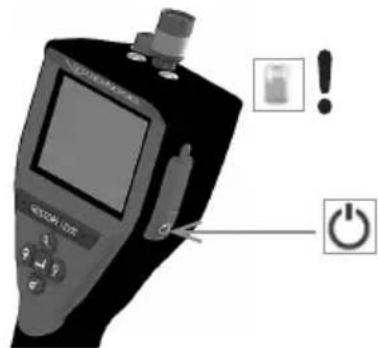 Diagram of a medical device with warning labels and power button, showing screen, buttons, and power symbol