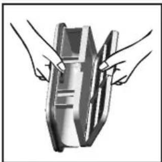Illustration of two hands holding a rectangular object with internal lines (no text or symbols)