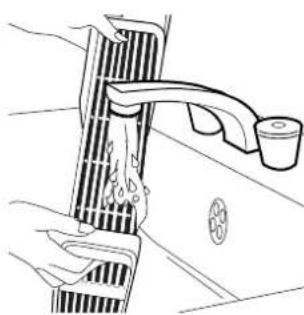 Line drawing of a hand washing a showerhead with a cup, no text or symbols present