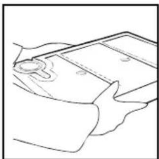 Line drawing of a hand holding a rectangular object with a small circular mark on the left (no text or symbols)