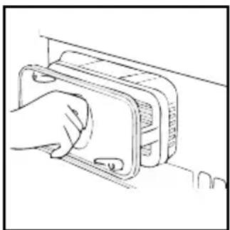 Line drawing of a hand inserting a component into a device (no text or symbols)
