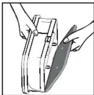 Illustration of hands holding a rectangular object with a knife inserted, no text or symbols present